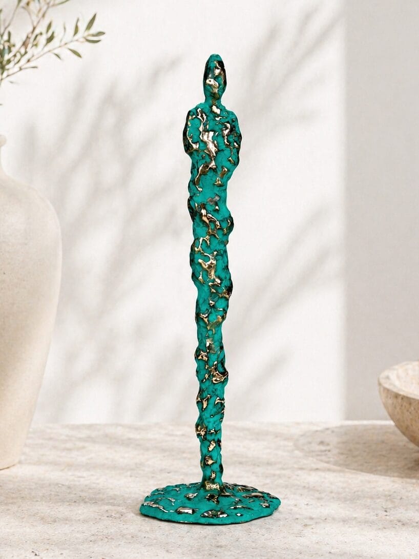 Gejser - bronzeskulptur der hylder mennesket og naturen